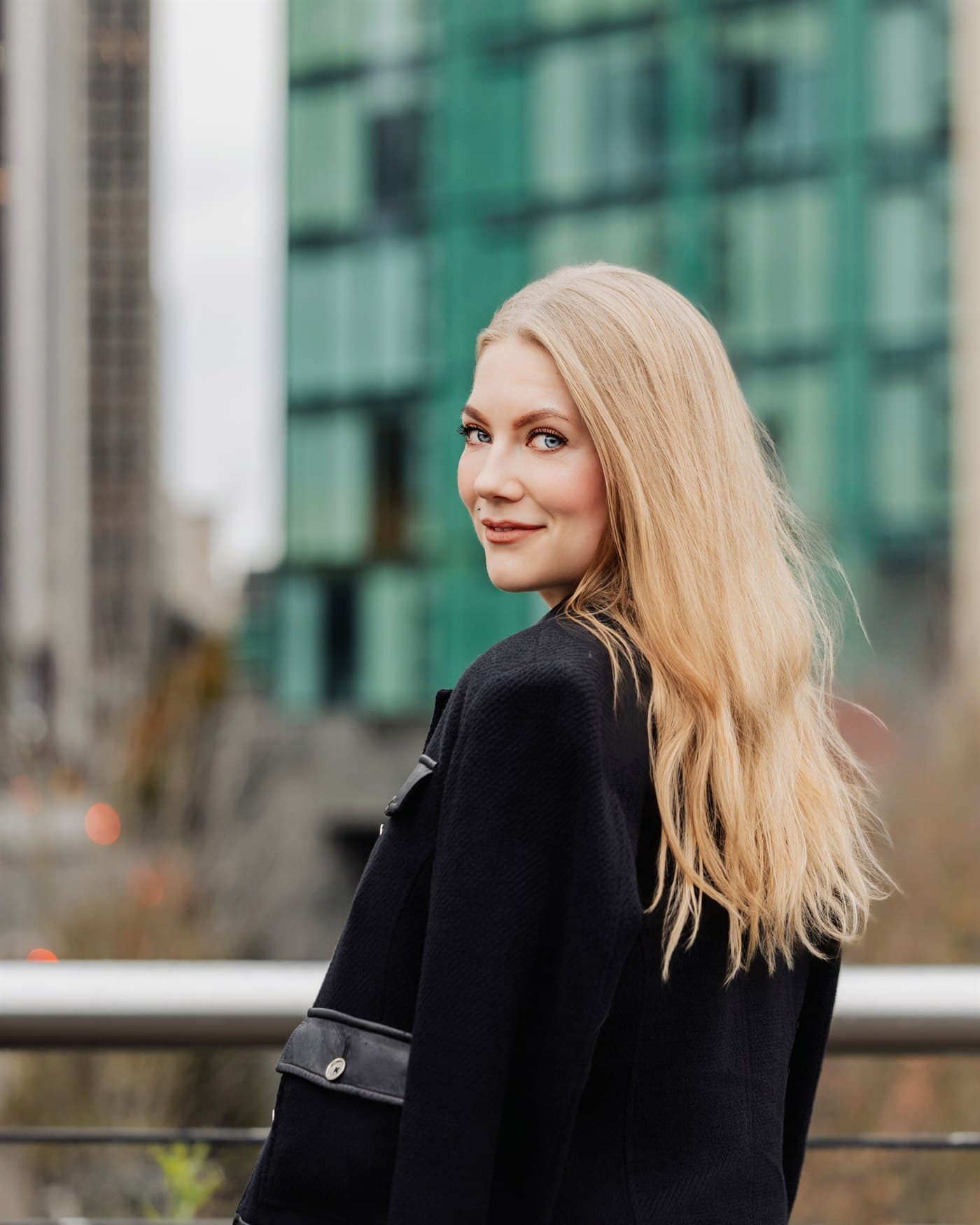 Kimberley Karstunen, Founder of TAKKLE, on a Vancouver waterfront overlook.